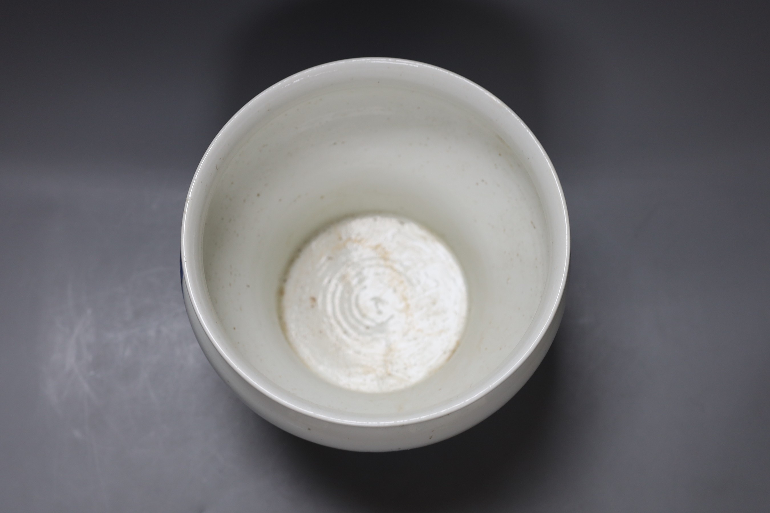 A Chinese under-glazed blue and white dragon bowl, 18cm tall